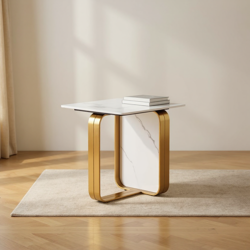 Modern marble side table with gold metal frame, styled with books on rug in living room