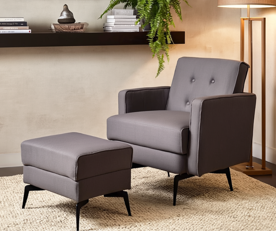 Modern gray armchair with matching ottoman on a beige rug in a cozy living room setting.