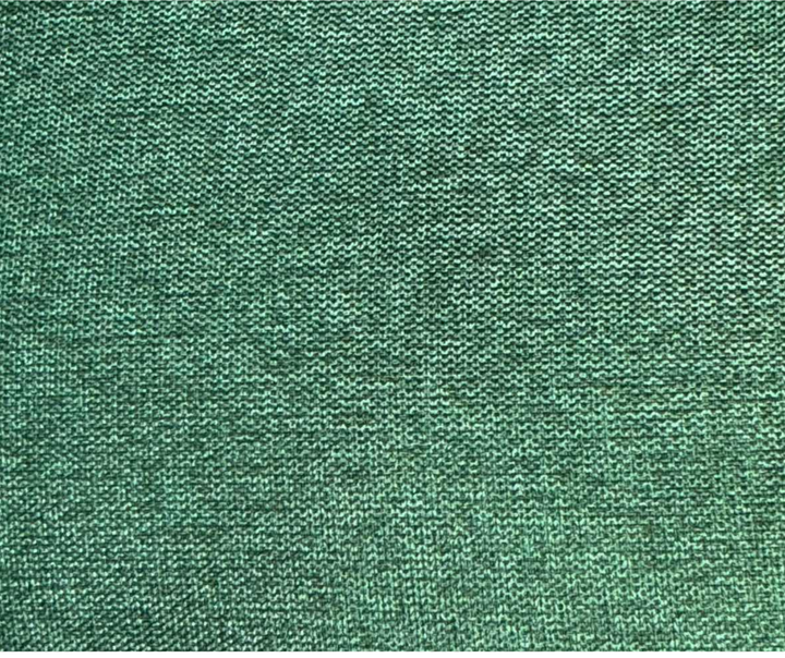 Close-up of green woven upholstery fabric texture for furniture