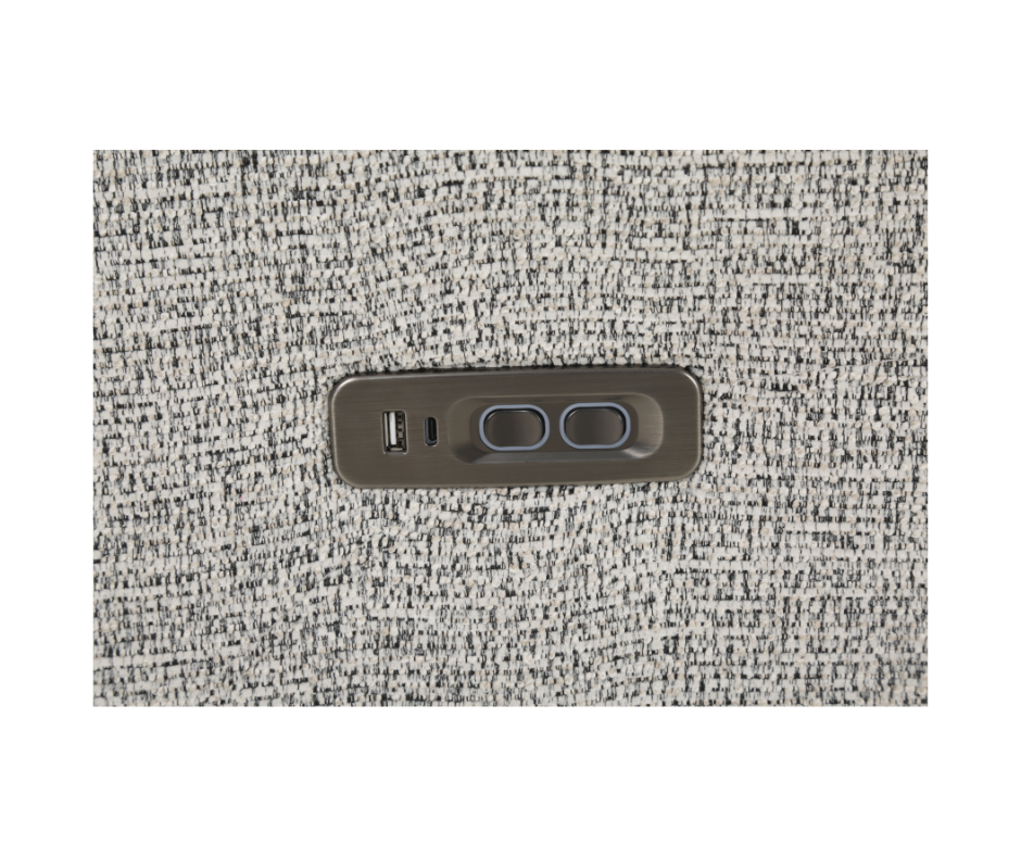 Close-up of a fabric sofa with built-in USB charging port and recliner control buttons
