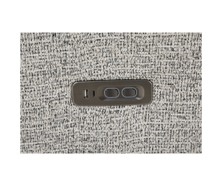 Close-up of a fabric sofa with built-in USB charging port and recliner control buttons
