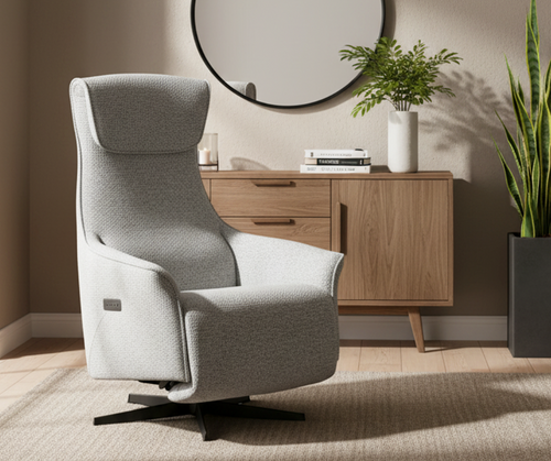 Modern gray accent chair in living room with wood sideboard and indoor plants