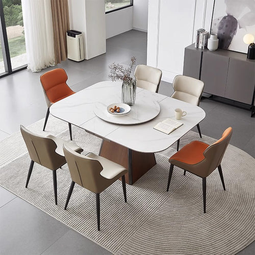 Modern marble dining table with six chairs in a contemporary dining room setting
