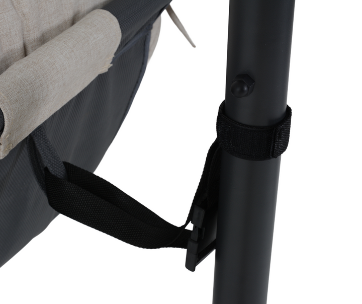 Close-up of furniture frame with metal leg, fabric seat, and adjustable strap.