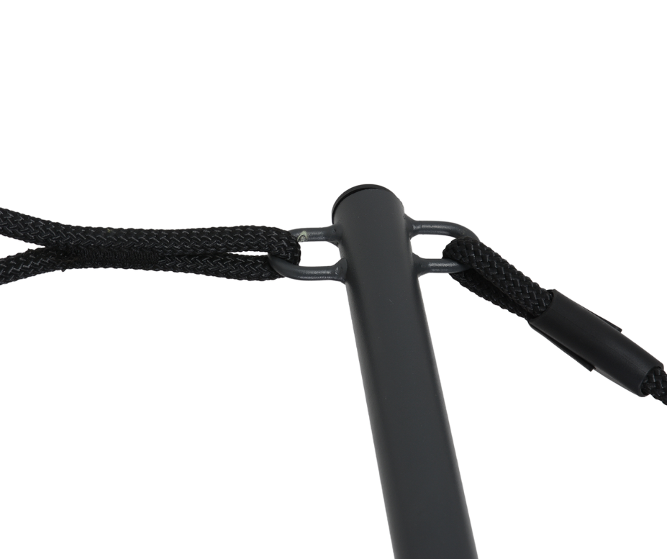 Close-up of a black metal furniture leg with attached braided rope support