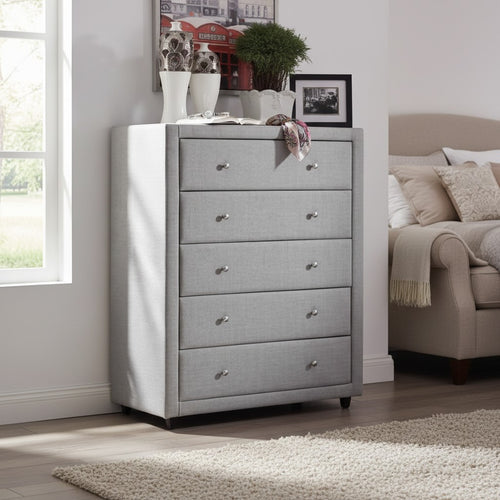 Modern grey upholstered chest of drawers in a bright bedroom with decorative vases and framed art