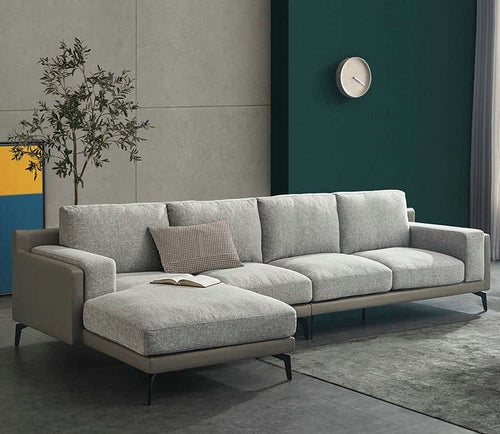 Modern gray sectional sofa with chaise lounge in contemporary living room