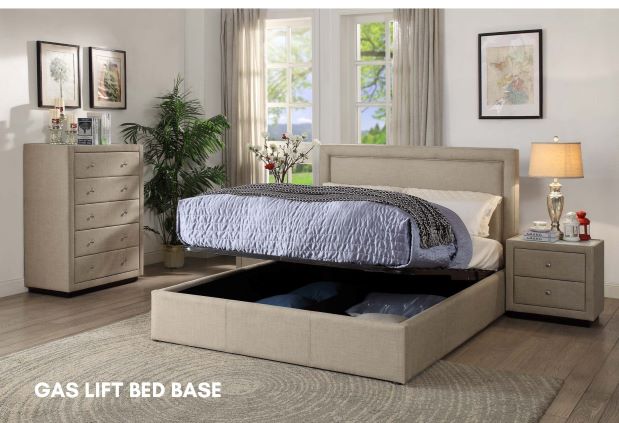 Beige gas lift storage bed with upholstered frame in modern bedroom setting