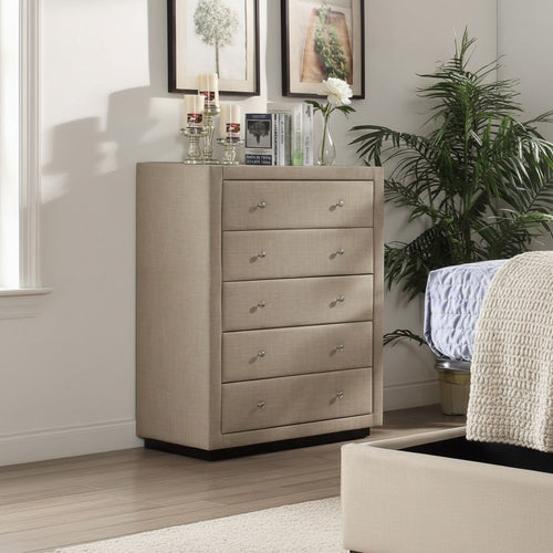 Modern beige upholstered chest of drawers in a bright, cozy bedroom setting