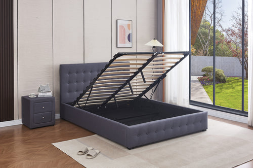 Grey tufted storage bed frame with lift-up mechanism in modern bedroom, featuring slatted base and matching nightstand.