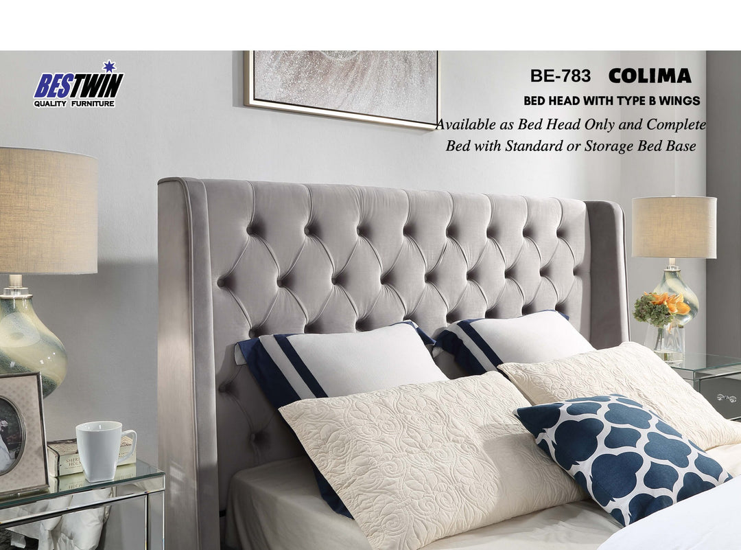 Upholstered tufted bed headboard with side wings in contemporary bedroom setting
