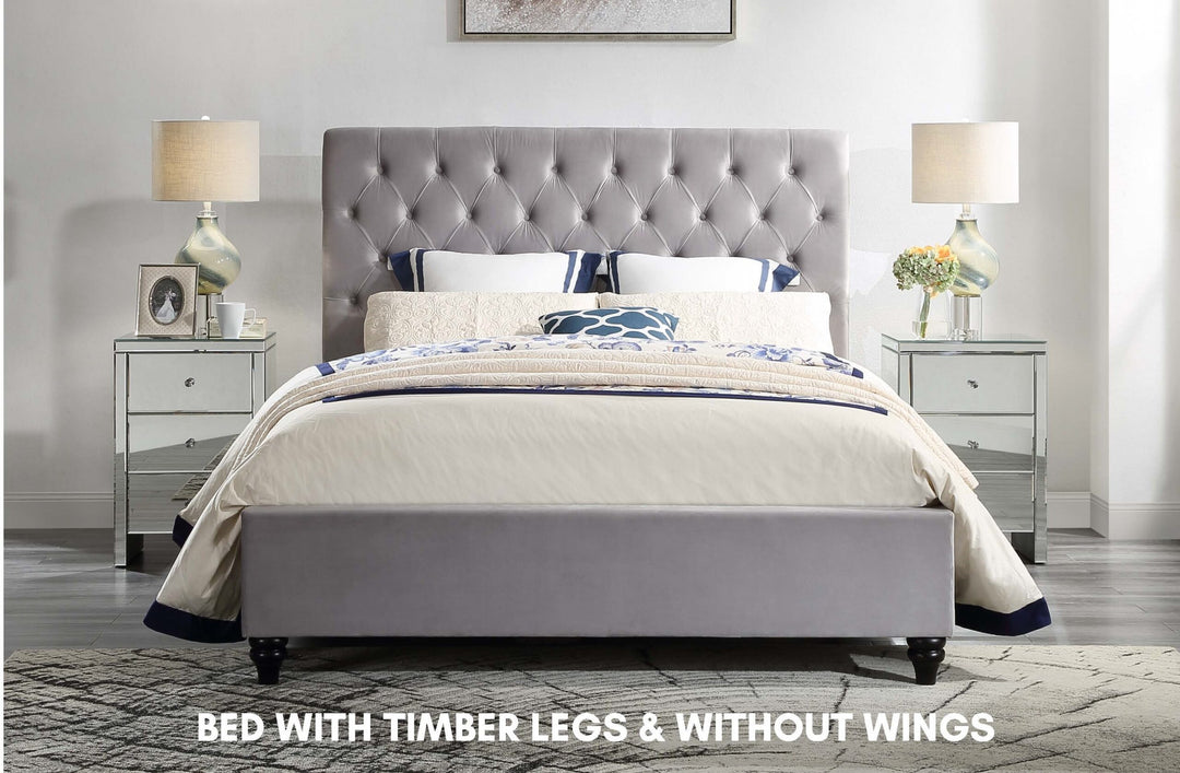 Grey upholstered bed with timber legs, no wings, mirrored bedside tables, bedroom setting
