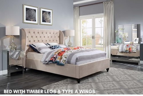Upholstered bed with timber legs and wingback headboard in modern bedroom setting