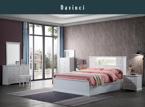 Modern bedroom set with white bed, storage drawers, nightstand, and pink bedding