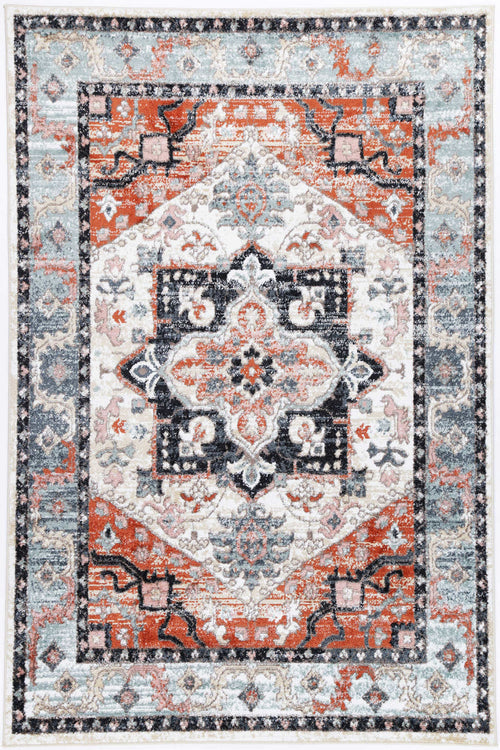 Vintage style area rug with geometric pattern in red, blue, and cream tones