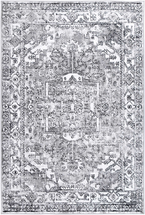 Grey area rug with vintage-inspired geometric and floral pattern, distressed design.
