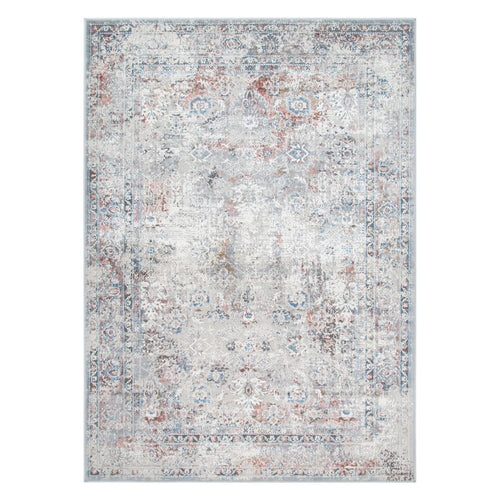 Distressed area rug with faded floral pattern in blue, grey, and rust tones, home decor.