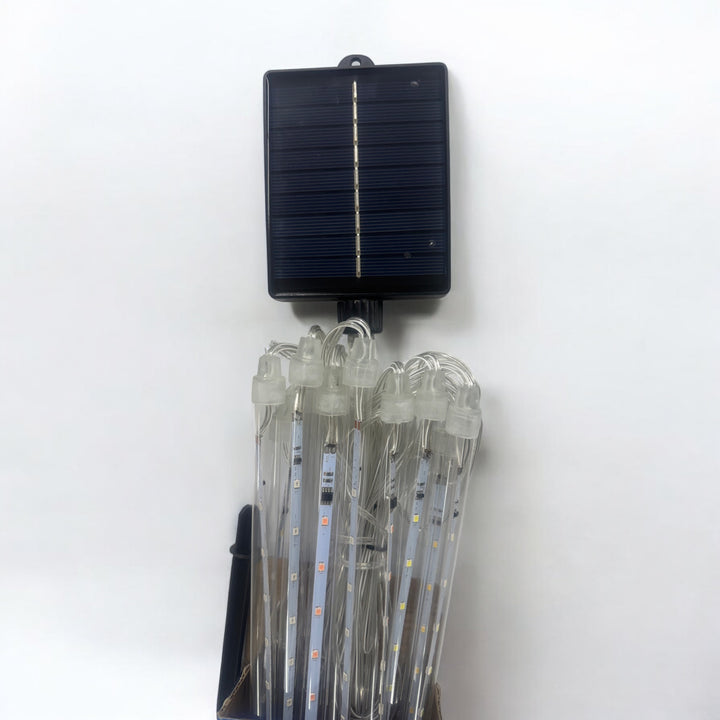 Solar-powered LED tube string lights with clear wires on a white background