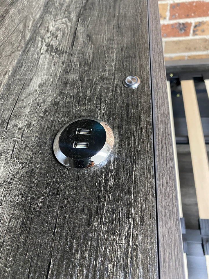 Wooden bed frame with built-in USB charging ports and control button