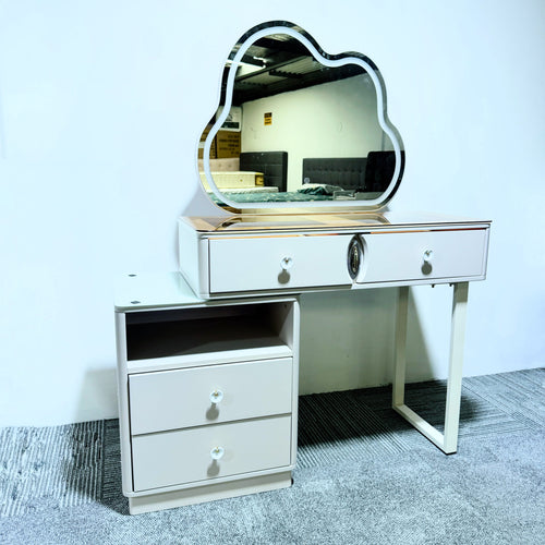 White vanity table with cloud-shaped mirror, drawers, and side cabinet for bedroom storage