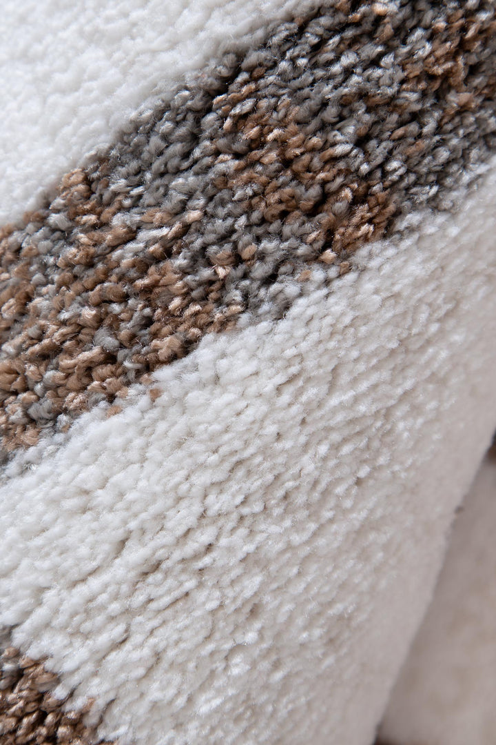 Close-up of soft textured fabric with beige and gray stripes, ideal for home furniture upholstery