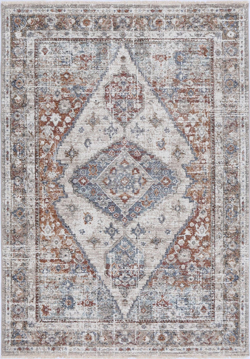 Vintage-style area rug with geometric medallion pattern in beige, blue, and rust tones