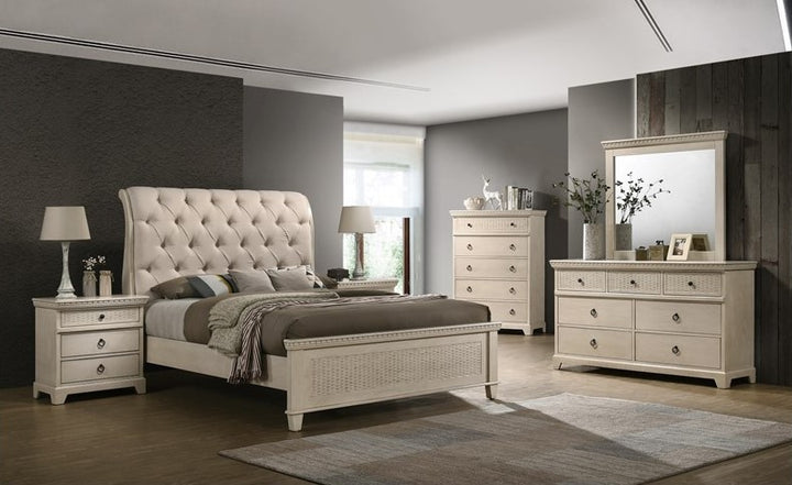 Elegant beige bedroom set with tufted bed, two nightstands, dresser and mirror in modern room