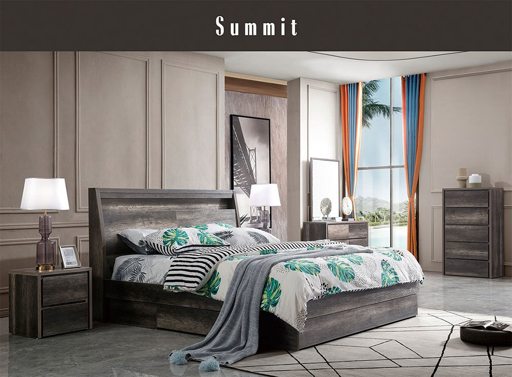 Modern bedroom featuring a grey wood bed, nightstands, dresser, and tropical bedding.