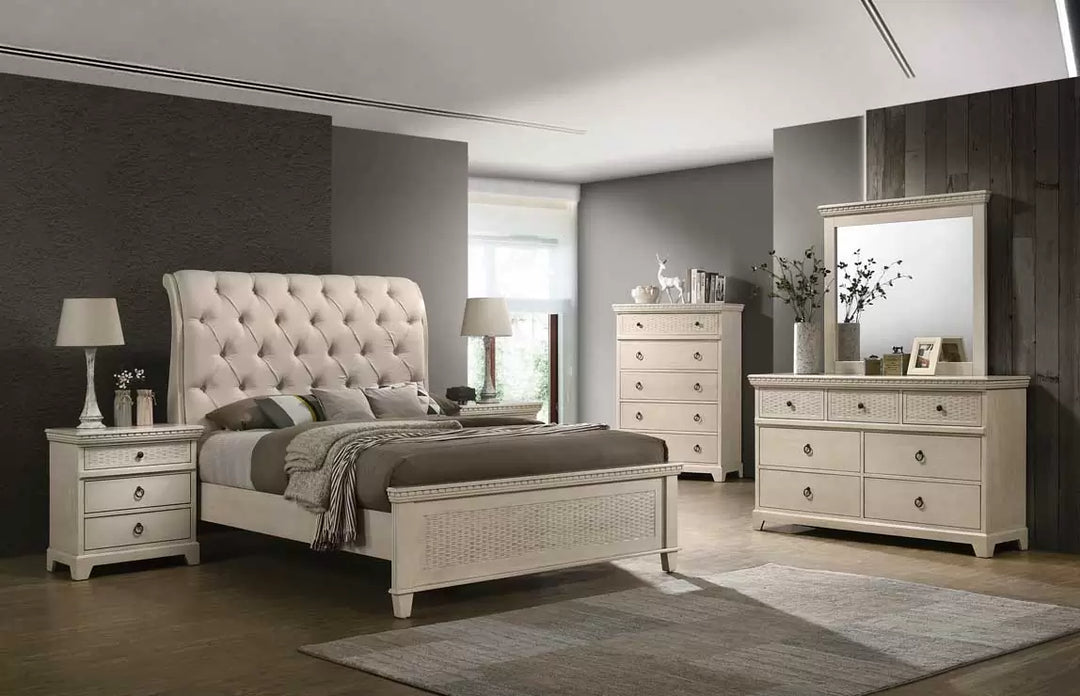 Modern bedroom set with tufted bed, matching nightstands, dresser, and mirror in neutral tones