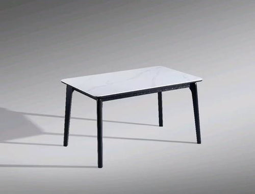 Modern white marble-top dining table with black legs, sleek design for contemporary homes