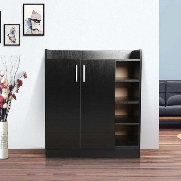 Modern black wooden storage cabinet with shelves in a living room setting