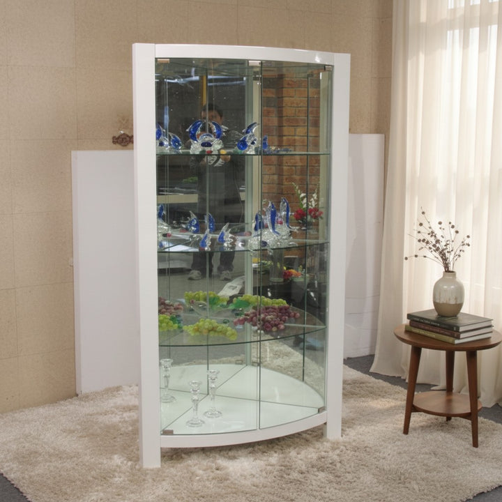 Modern glass display cabinet with white frame, glass shelves, and decorative items in a home setting