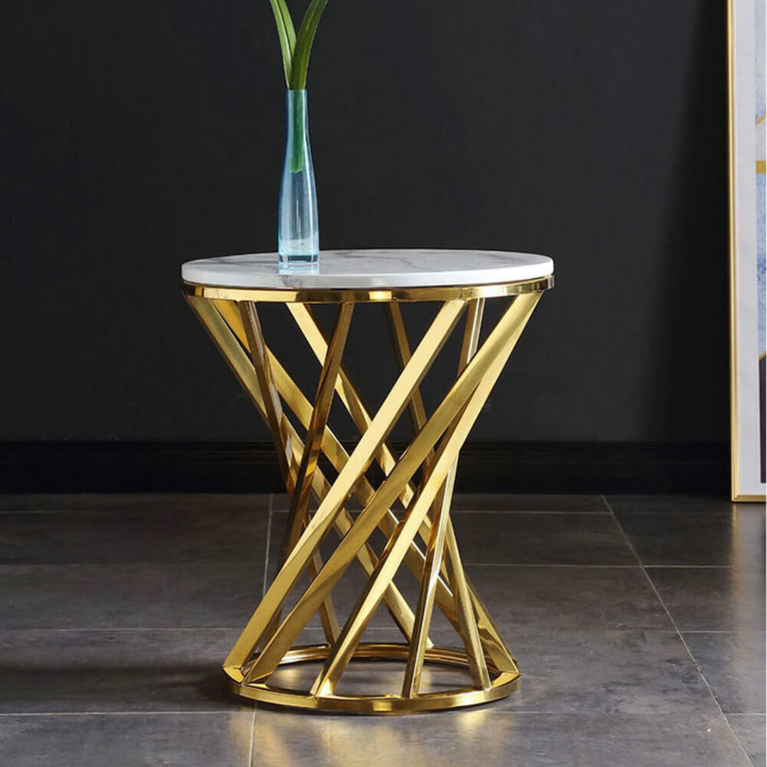 Modern round side table with gold geometric metal base and white marble top, decorative vase