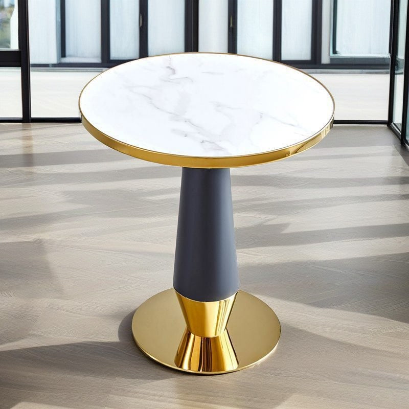 Round marble side table with gold base and modern design in a bright home interior
