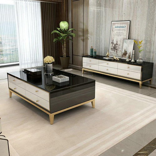 Modern black and white coffee table with gold legs in stylish living room, perfect for contemporary home decor