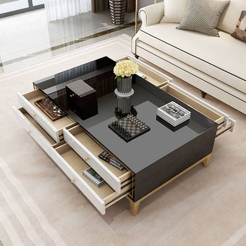 Modern black glass coffee table with storage drawers, gold legs, chess set, and vase in living room