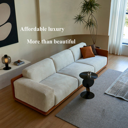 Modern white corduroy sofa with brown frame in stylish living room, affordable luxury furniture