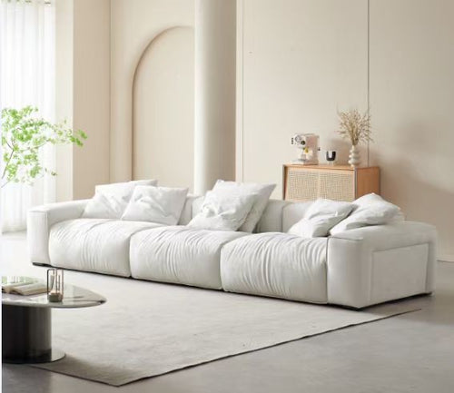 White modern sectional sofa with plush cushions in minimalist living room, ideal for Sydney homes