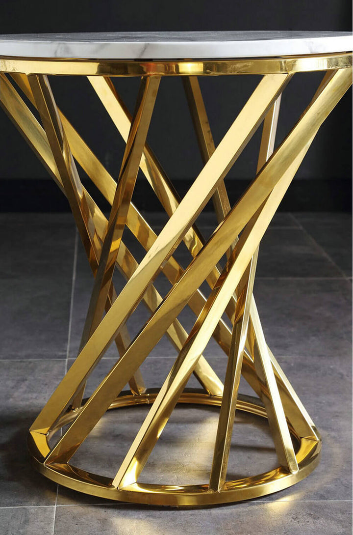 Modern side table with a gold metal geometric base and round white marble top