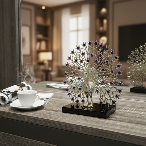 Elegant silver peacock sculpture with purple gems on wooden table, luxury home decor accent piece