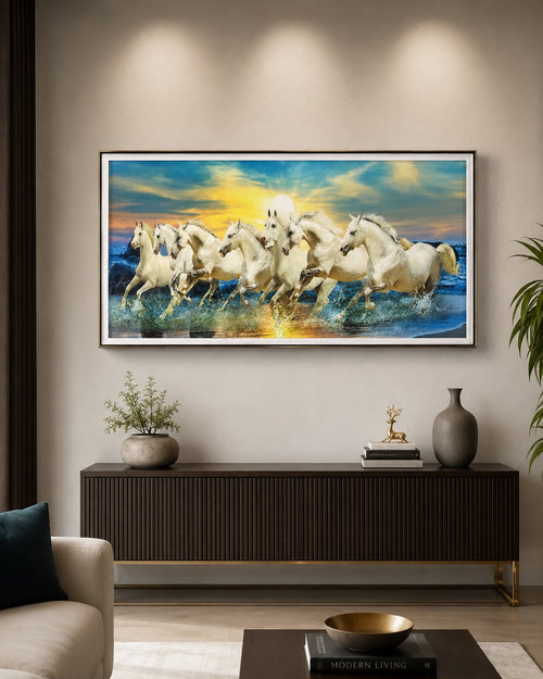 White horses galloping at sunset wall art above modern TV unit in living room