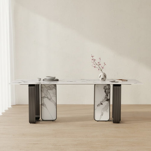 Modern marble dining table with decorative vase and dishes in minimalist room