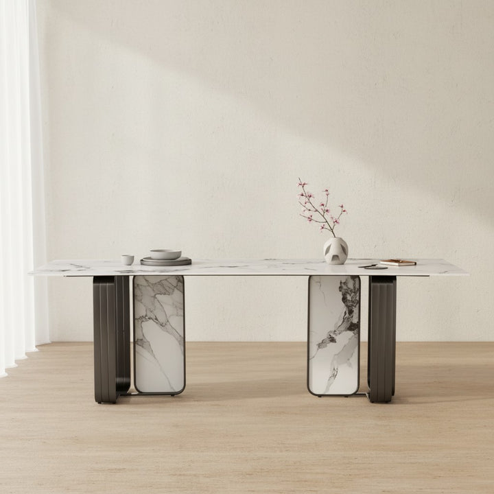 Modern marble dining table with decorative vase and dishes in minimalist room