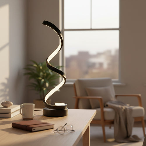 Modern spiral LED table lamp on wooden desk in cozy living room with armchair and indoor plant