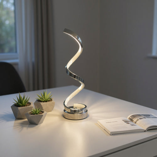 Modern spiral LED table lamp with three small succulents on a white desk in a home interior