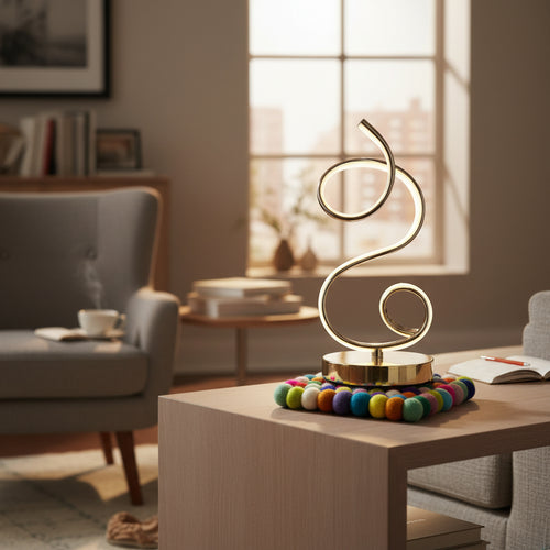 Modern gold spiral table lamp on wooden coffee table in cozy living room setting
