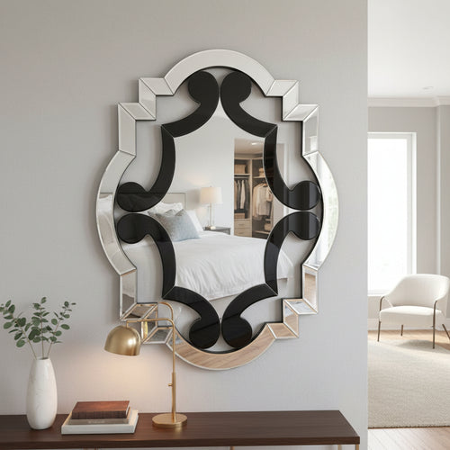 Elegant geometric wall mirror above console table in modern bedroom interior