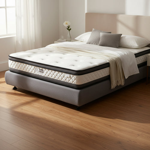Modern bedroom with upholstered bed frame, plush mattress, and decorative pillows in natural light