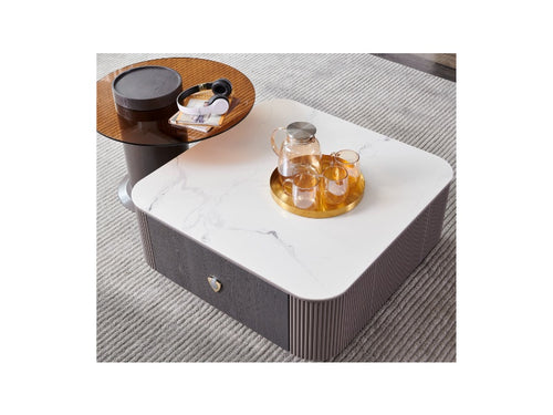 Modern marble-top coffee table with storage drawer, styled with glass tea set on gold tray in living room