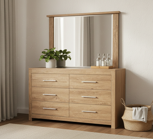 Modern wooden dresser with large mirror, potted plant and bottles in a stylish bedroom